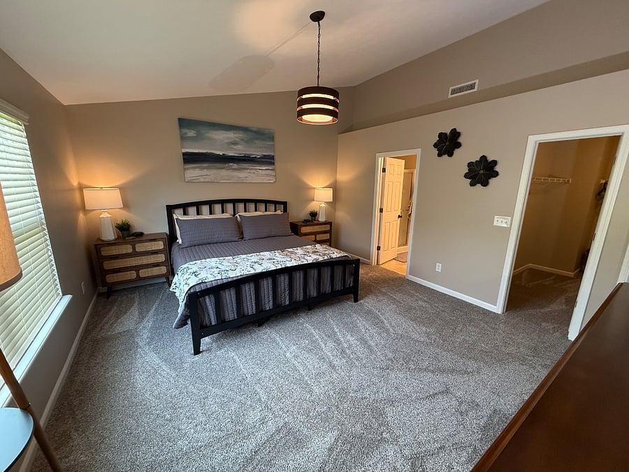 Huge master bedroom with view of the walk-in closet and en-suite bathroom. 