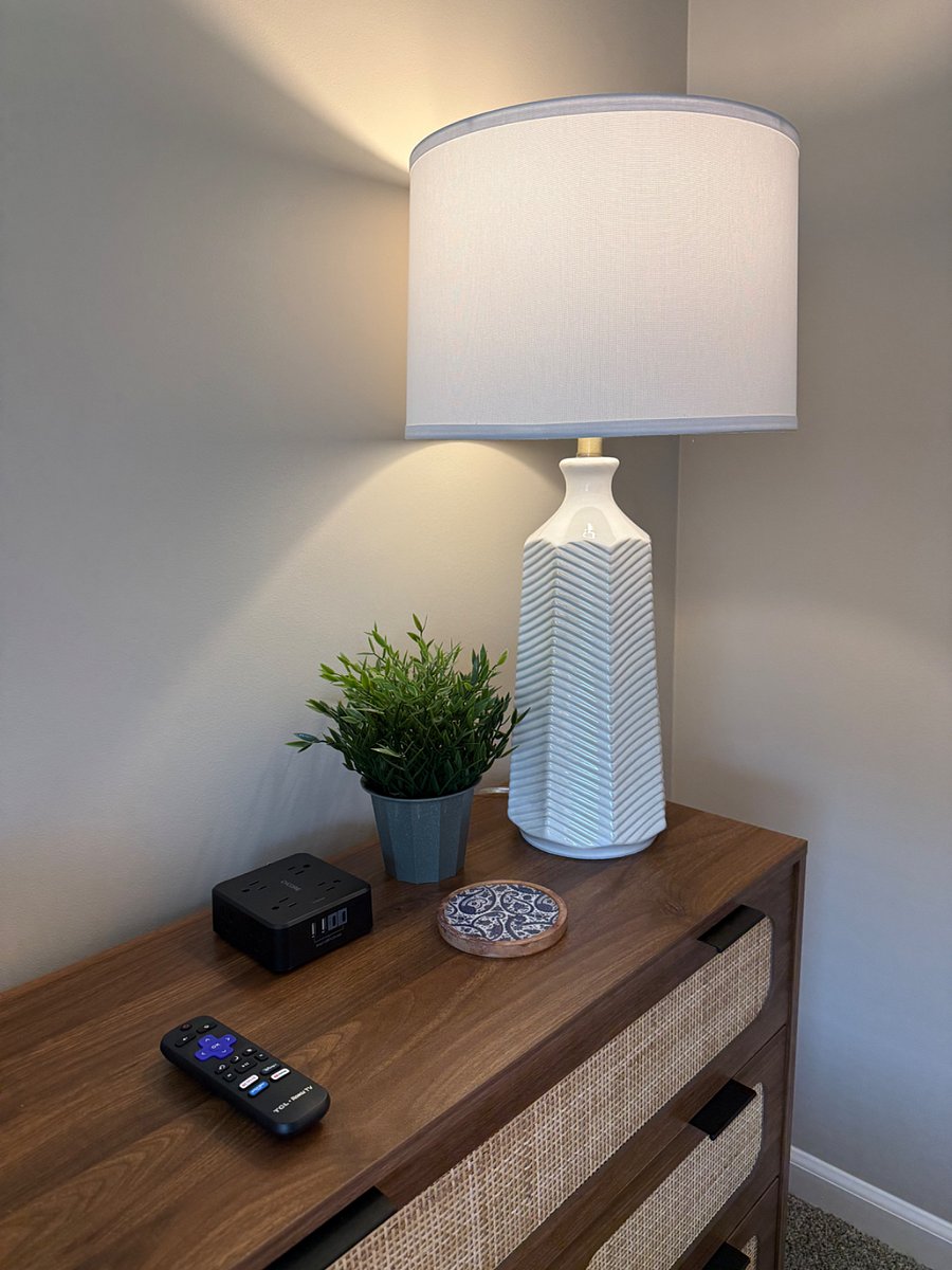 Each nightstand in the home has a station to easily plug in chargers and a lamp for soft lighting option. 