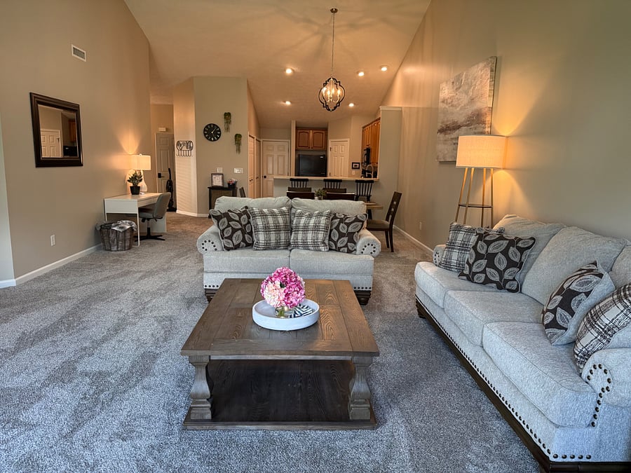 Great living room with couch and loveseat with coffee table. 