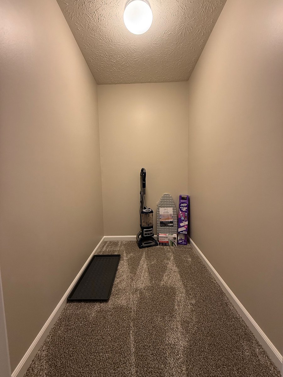 Large closet off of the entry with vacuum, stiffer and ironing board and iron. 