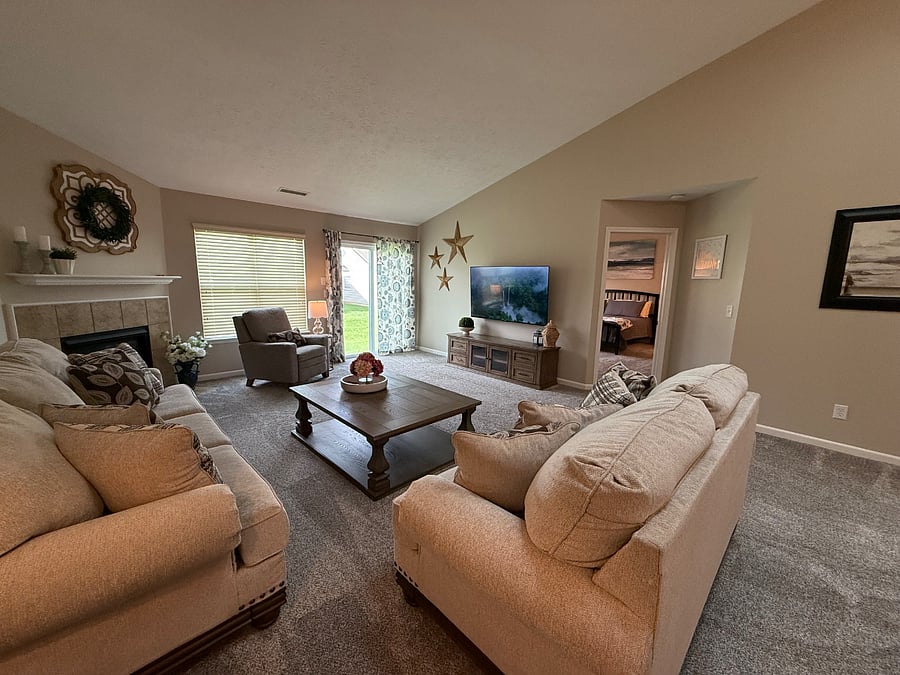 Comfortable, homey living room with 65" Roku TV. 