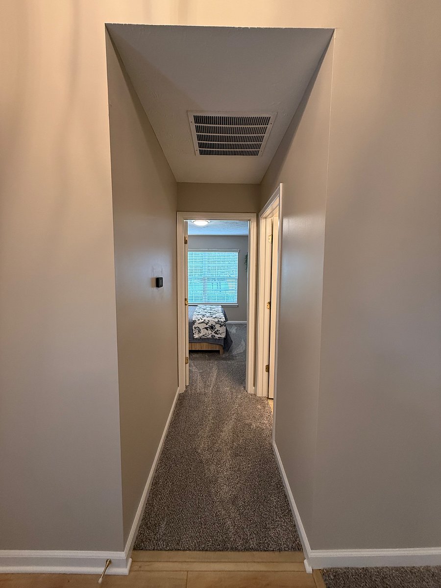 Hallway off of entry with bathroom and Queen Bedroom. 