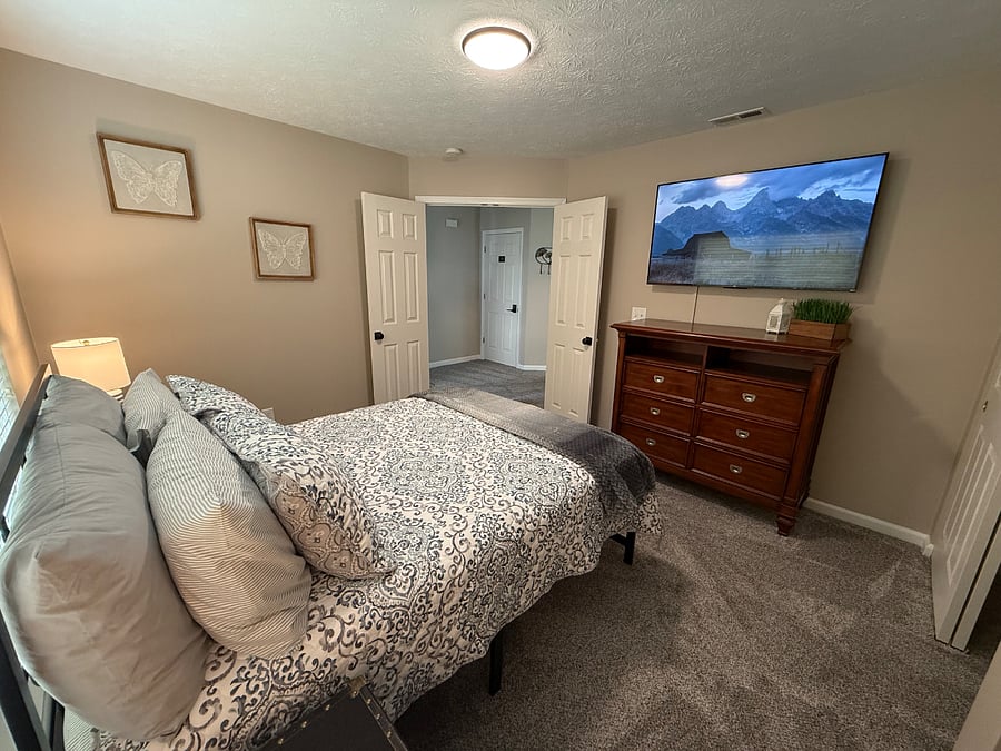 Full size bed with 55" Roku TV, dresser and nightstands. 