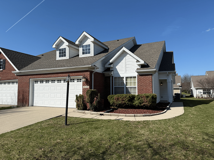 View of the outside of the home. You can enter through the garage of front door. 