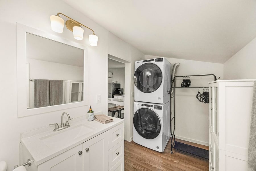 Designed for everyday ease with in-unit laundry, a full vanity, and space to refresh and reset during your stay!
