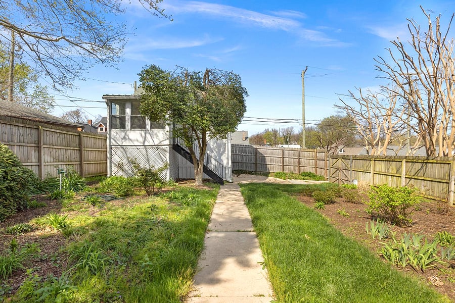 Follow the charming path lined with greenery as you make your way to your home away from home!