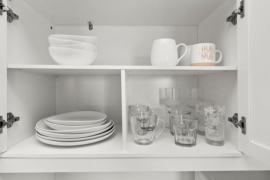 Fully stocked with dishes, glassware, and mugs. Ready for everything from quick bites to full meals!