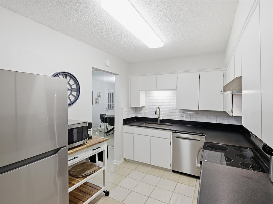 This fully stocked kitchen has micro-wave, crock pot, coffee pot, electric kettle and pantry.