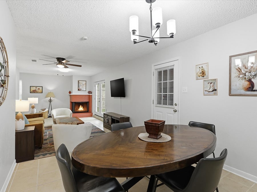 Large dining area opens to step down living space.