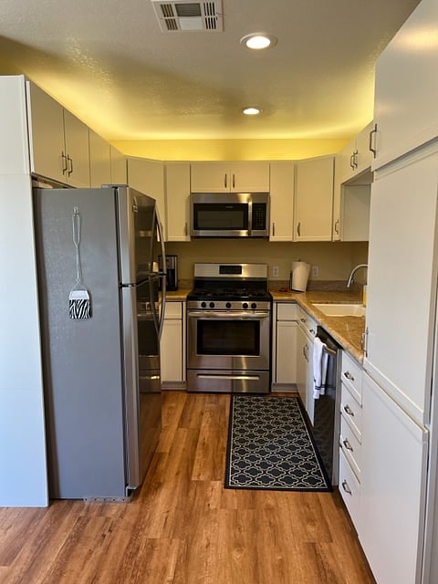 Full sized refrigerator, stove, oven, microwave, toaster oven.