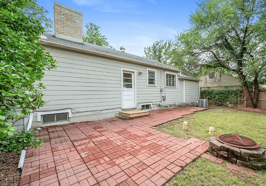 Fenced backyard with firepit and patio