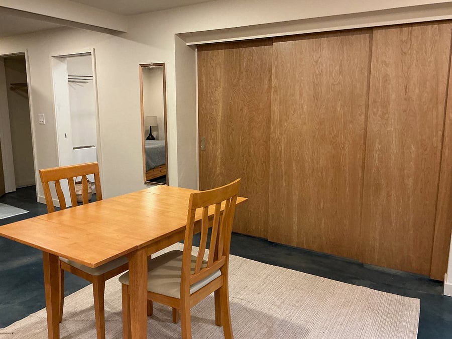 wood panels slide out to create optional wall between front room and kitchen