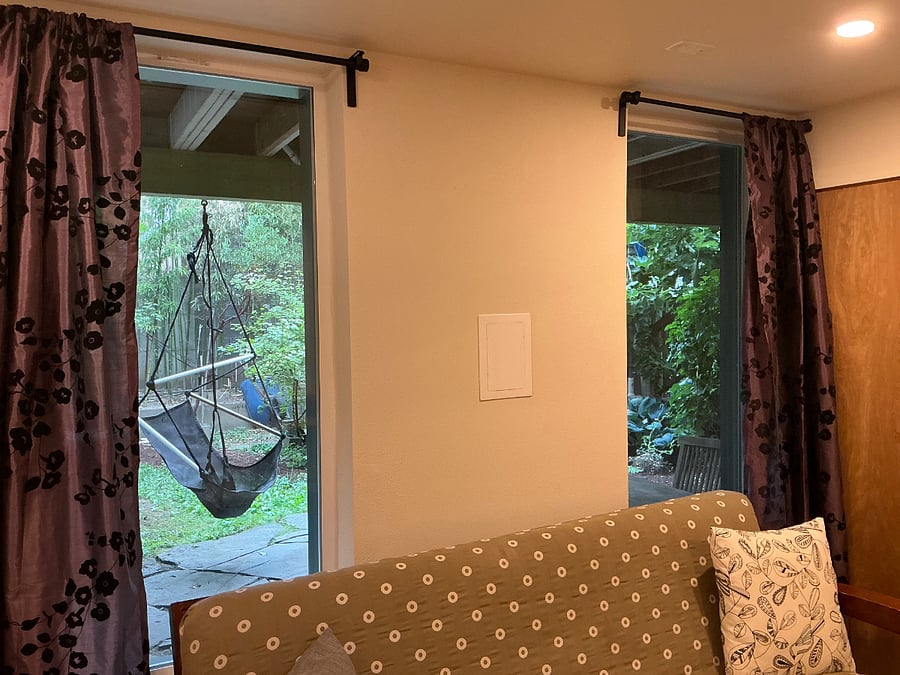 swing chair in garden, viewed from front room