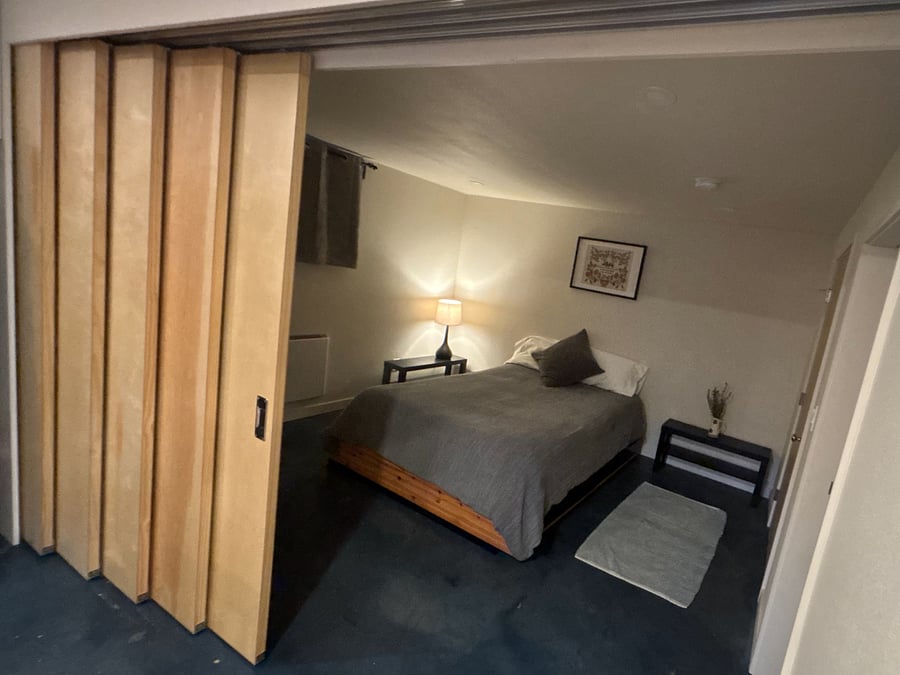 wood panels slide out to create optional wall between front room and kitchen