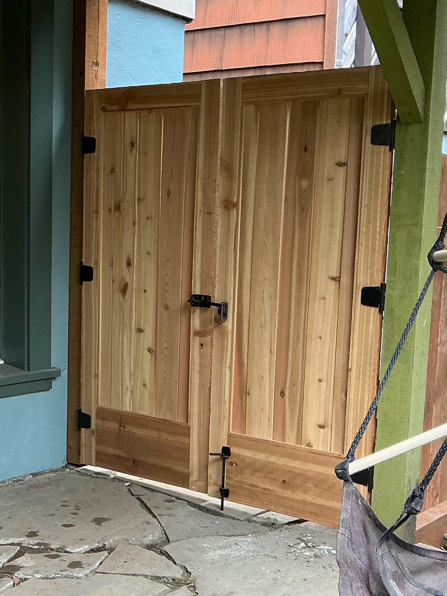 brand new wooden double gate and fence for extra privacy and security