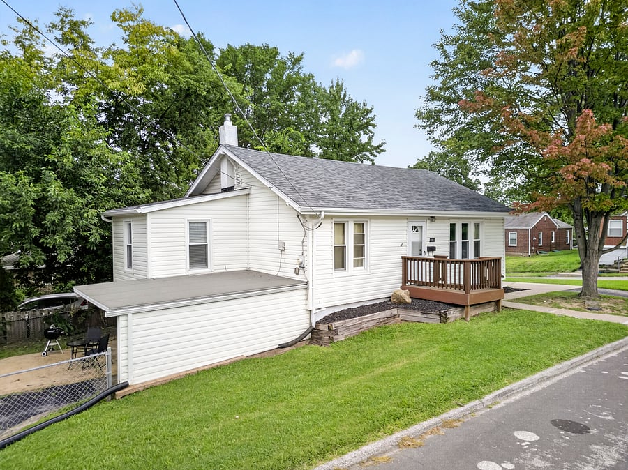 Covered carport, patio set & charcoal grill