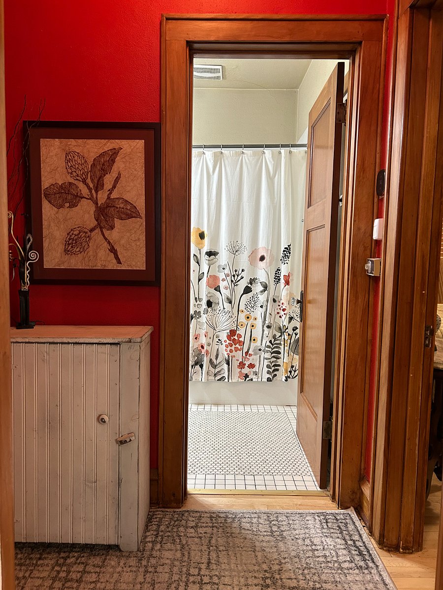 Hallway off the kitchen and leads to the 2 bedrooms and bathroom on main level.