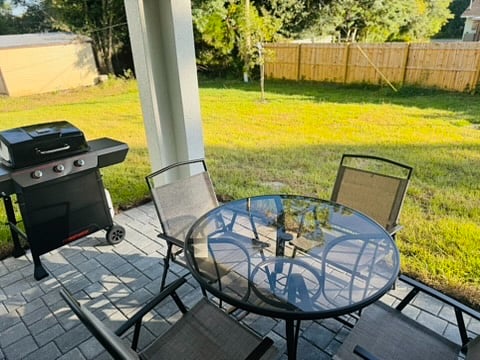 Patio with dining table and BBQ