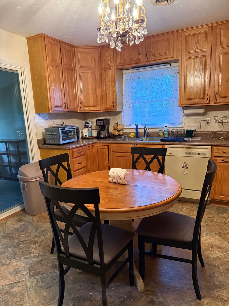 Kitchen stocked with plates, glassware, flatware and more. 