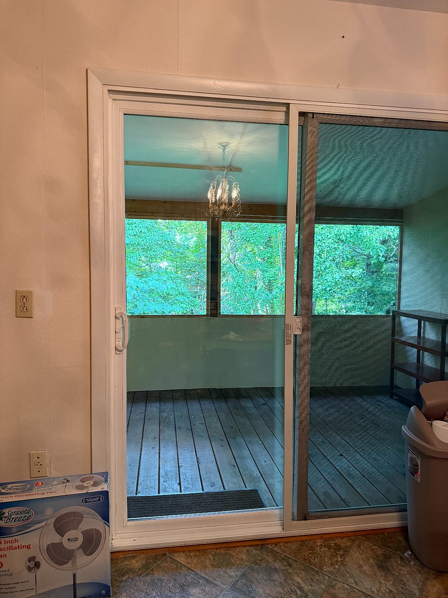 Covered, screened in back porch right off of the kitchen.