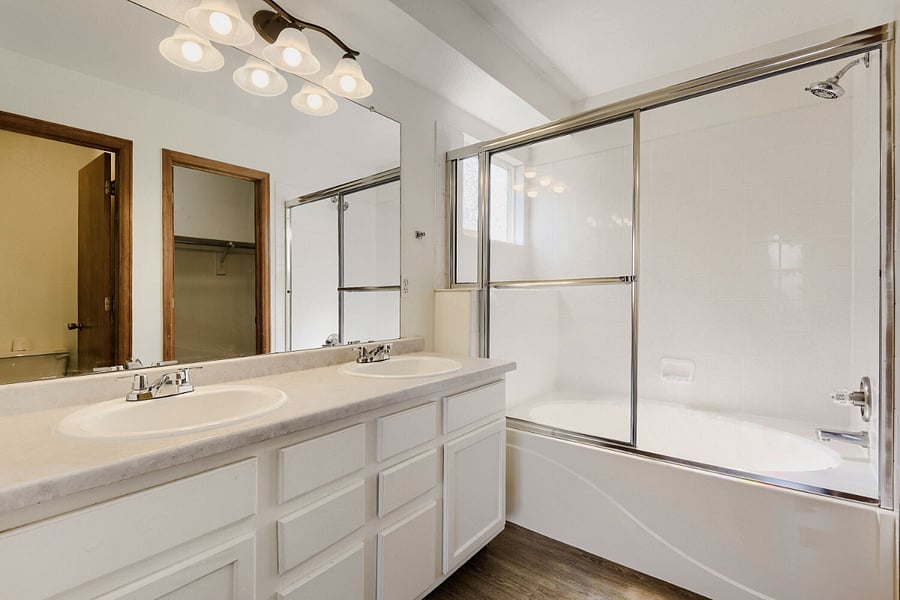 Primary bedroom bathroom with walk-in closet