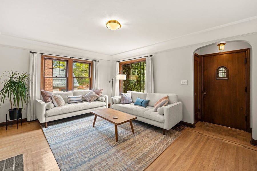 Living Room with seating for six facing the word burning fireplace..