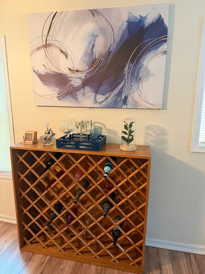 Artistic Wine Rack filled with painted bottles this is a non alcoholic wine rack for decor purposes, You may of course fill with wines and water