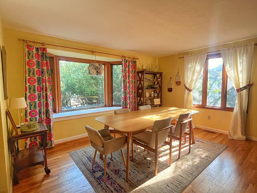 Dining area with bay window looking out onto the front patio