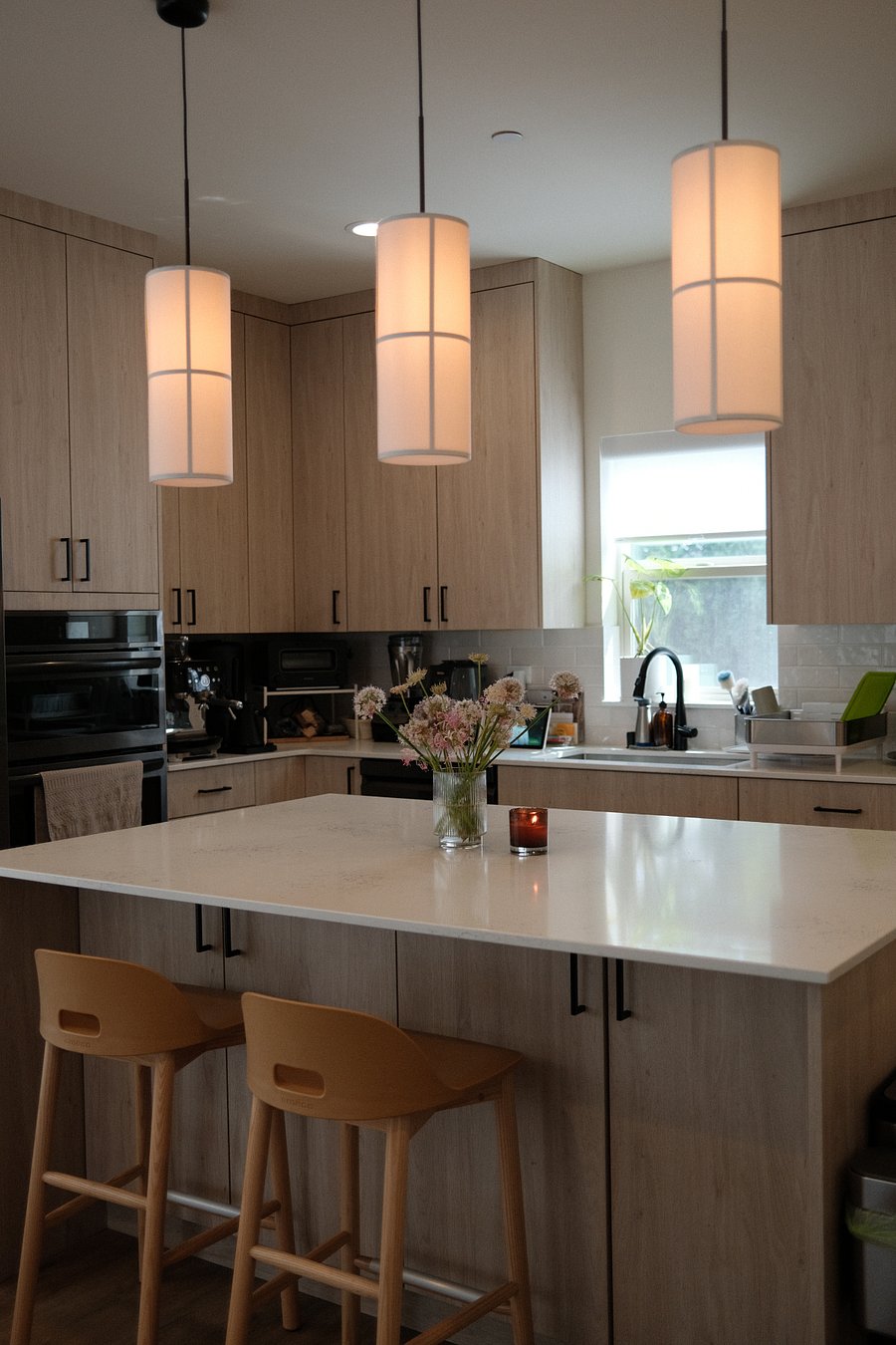 Kitchen - microwave/oven, sink, and stove top.