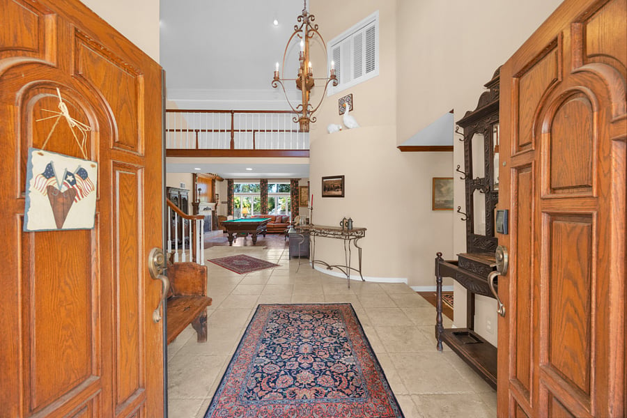 Step through the double doors into a bright, spacious entry that offers a warm welcome into the home.