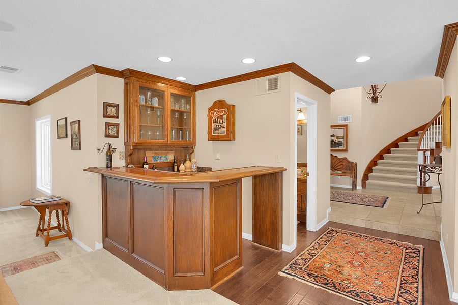Built-in wet bar just off the family room adds a convenient space for entertaining and relaxing at home.