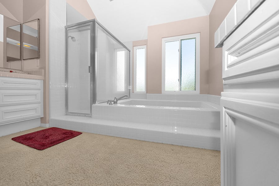 End your day with a relaxing soak in the oversized tub or refresh in the separate walk-in shower within the spacious primary bath.