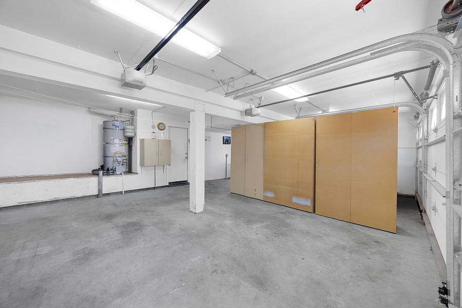 Spacious garage with partial guest access, providing convenient covered parking and additional room for storage during your stay.