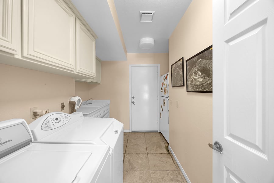 Dedicated laundry room with a full-size washer and dryer, making extended stays comfortable and convenient.