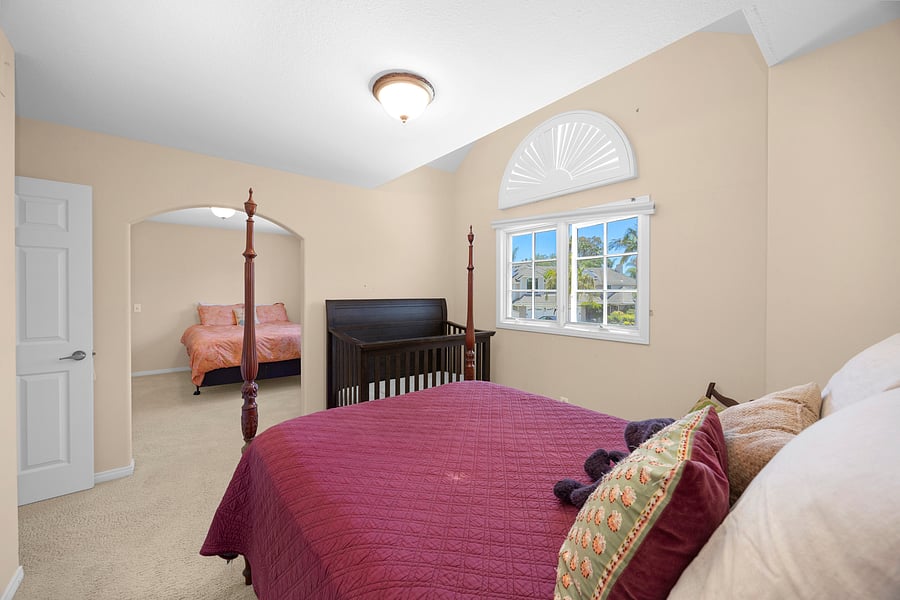 Family-friendly guest bedroom featuring a Full bed, crib, and spacious layout, perfect for guests traveling with little ones.