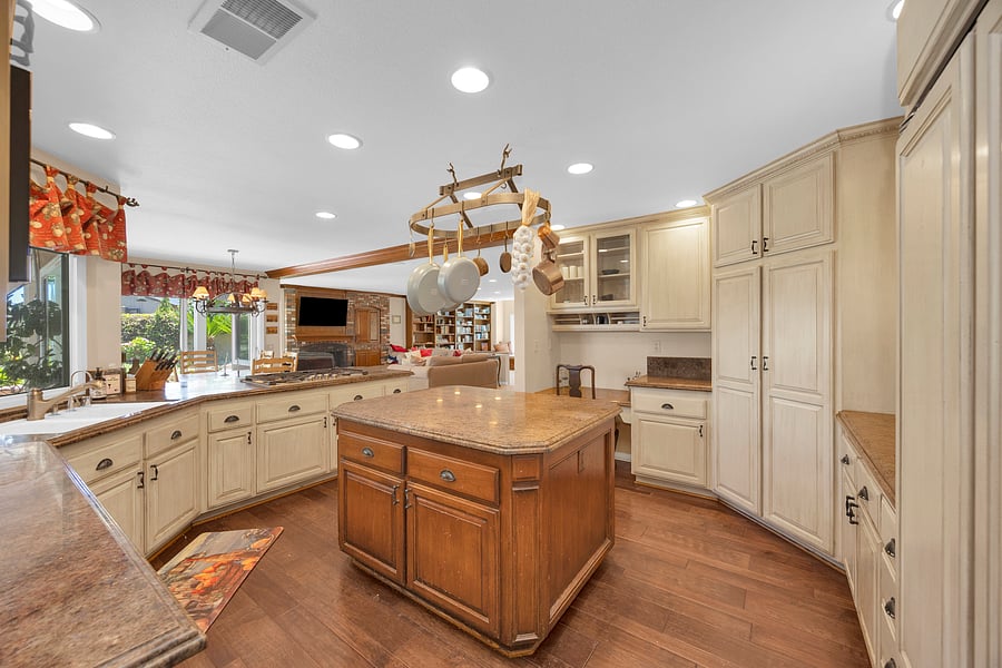 Spacious gourmet kitchen with a large center island, abundant prep space, and an open layout perfect for gathering.