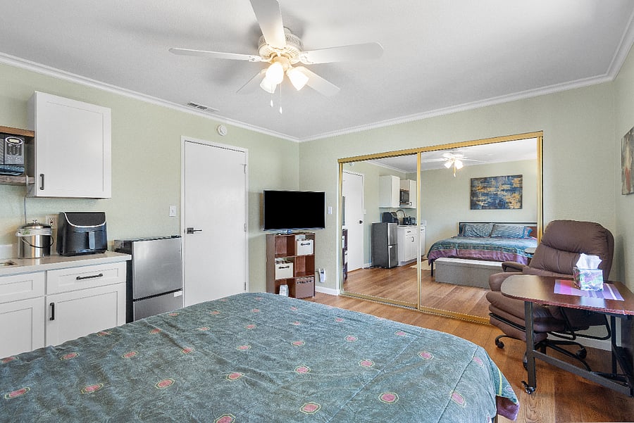 Smart TV, and the huge closet includes: iron, ironing board, air purifier, fan/space heater, room cooler