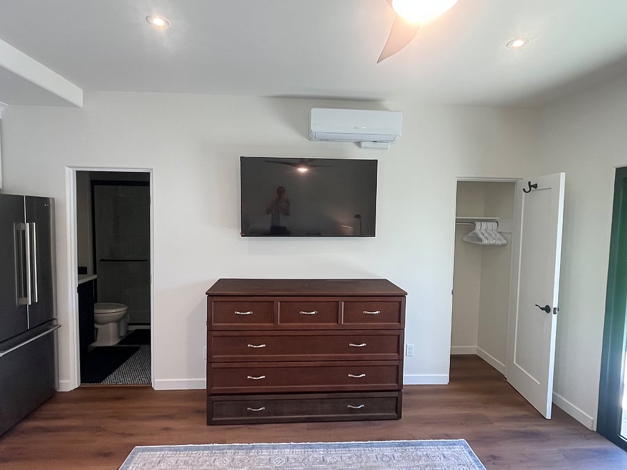 View showing doors open into full bathroom and closet.