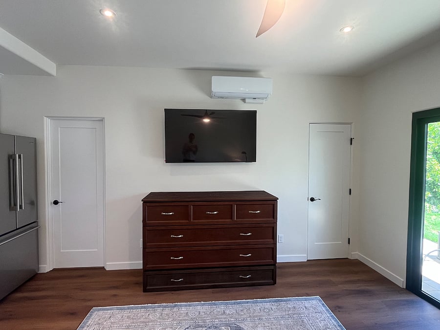 Brand new Murphy style collapsible bed allows for movement and additional work space and relaxing when not in use. Very comfortable for sleeping along with room darkening shades on accordion glass doors. Closet on right for hanging and storage. Bathroom on left is also brand new construction.