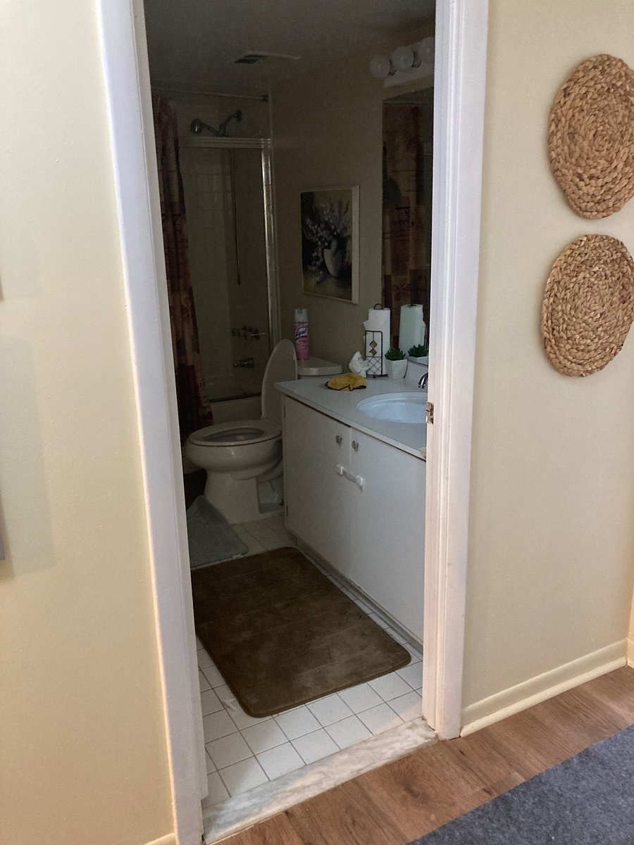 Hall bathroom with shower and tub