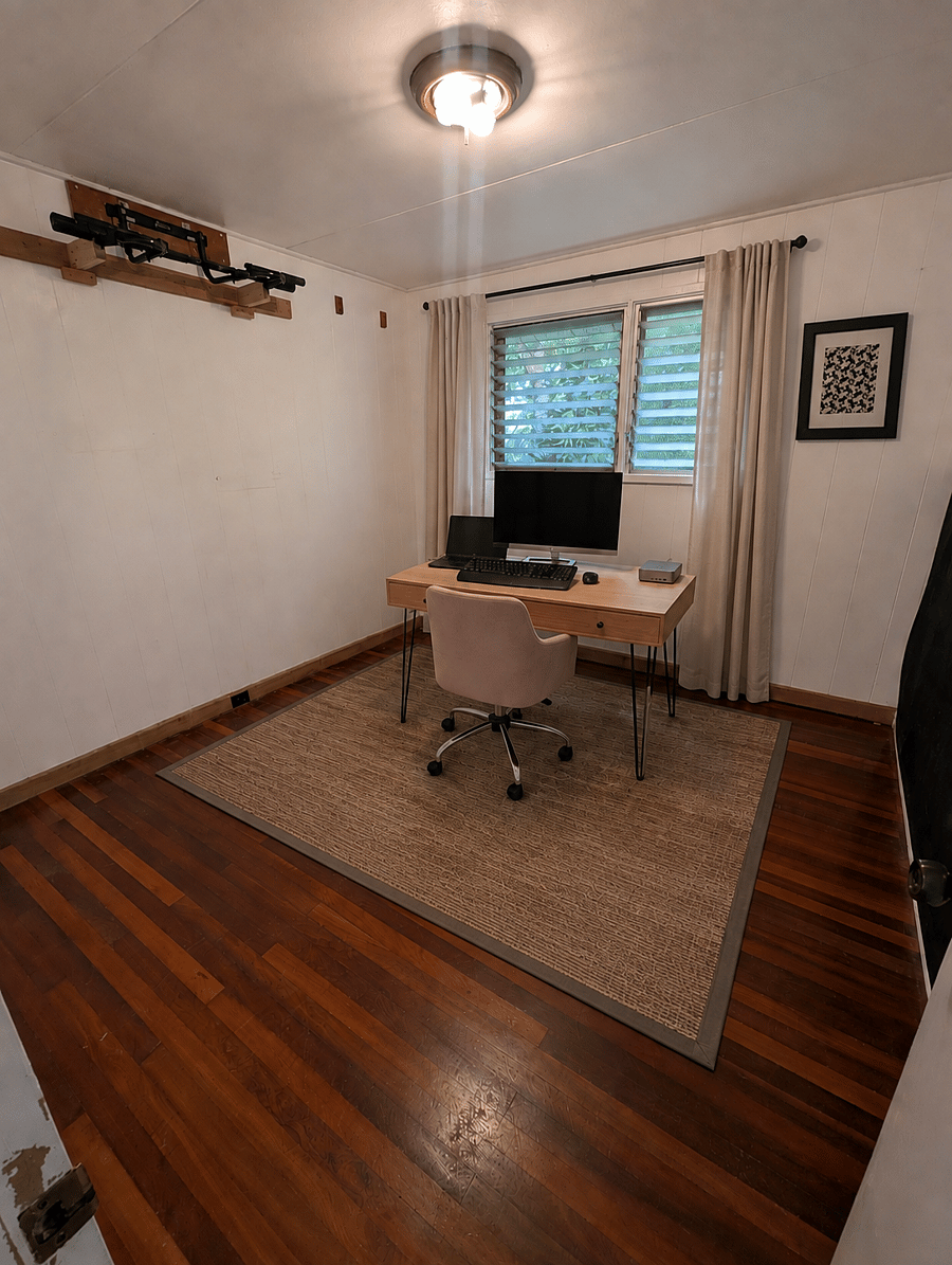 middle bedroom set up as a home office with fast internet