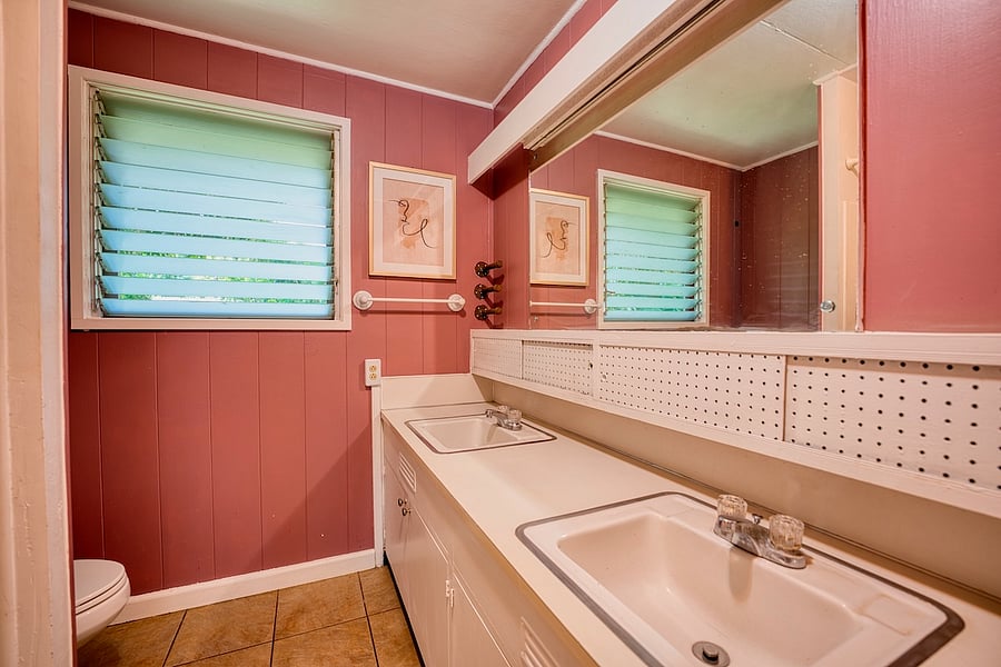 hallway bathroom with double sinks