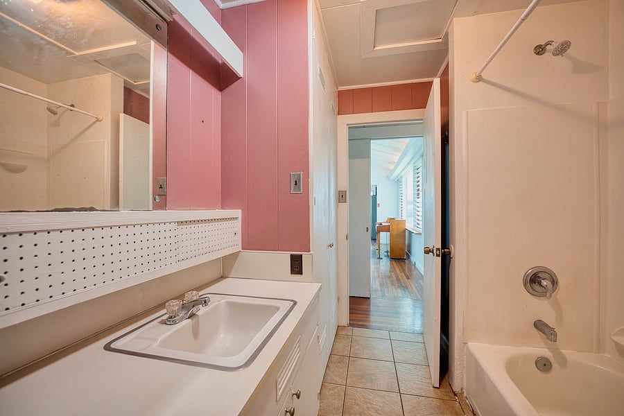 hallway bathroom with double sinks