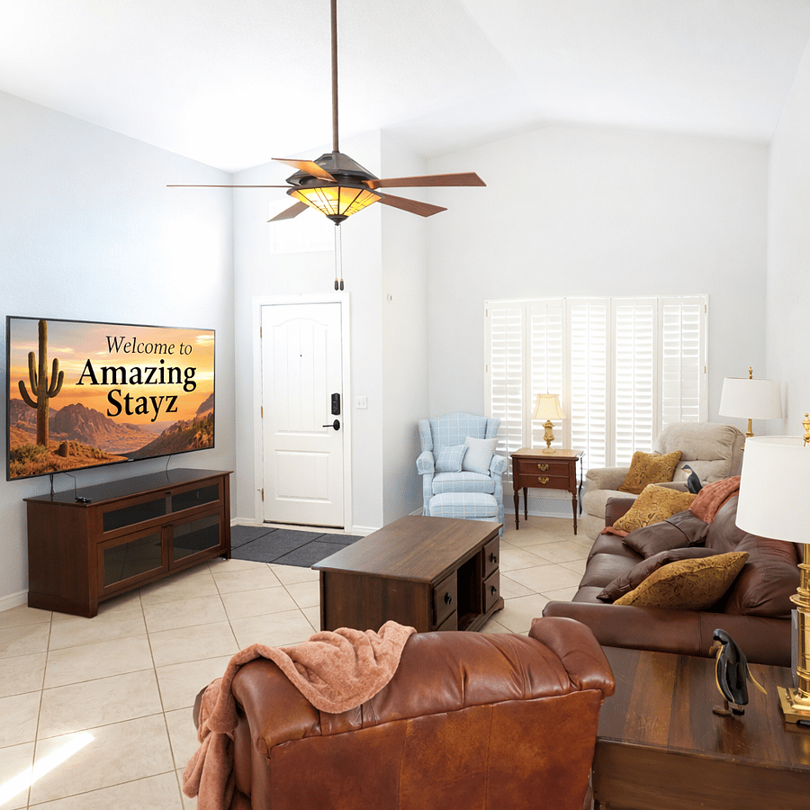 Living room with 75 in TV, massage chairs, electric recliners.