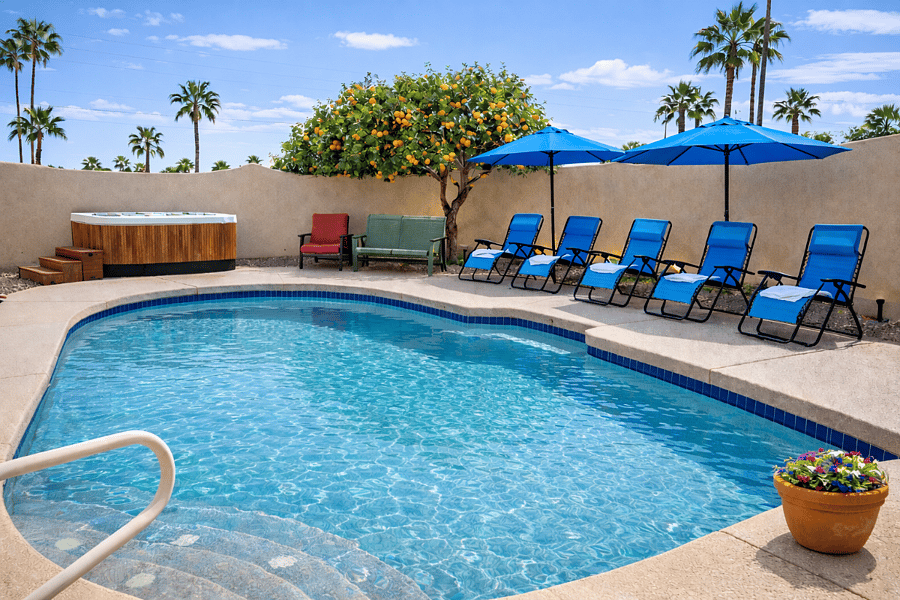 Pool with zero gravity loungers, umbrellas and so relaxing hot tub.