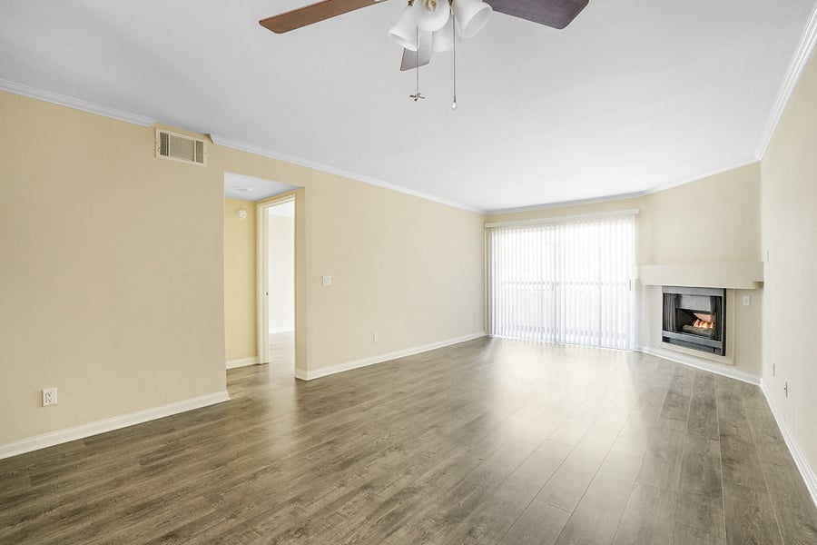 View of living room, fireplace, patio door