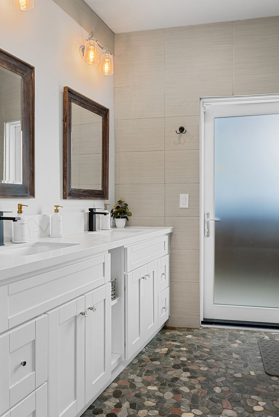 Full bathroom with double vanity and plenty of counter space.