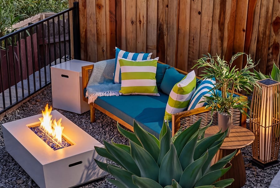 Private fire pit lounge with comfortable seating.