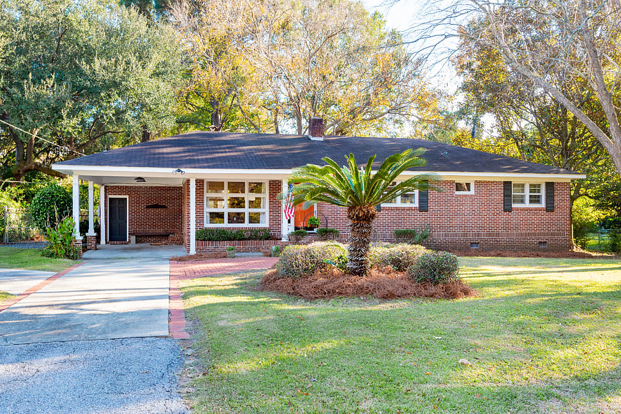 Front w Carport and 6 off street parking spaces