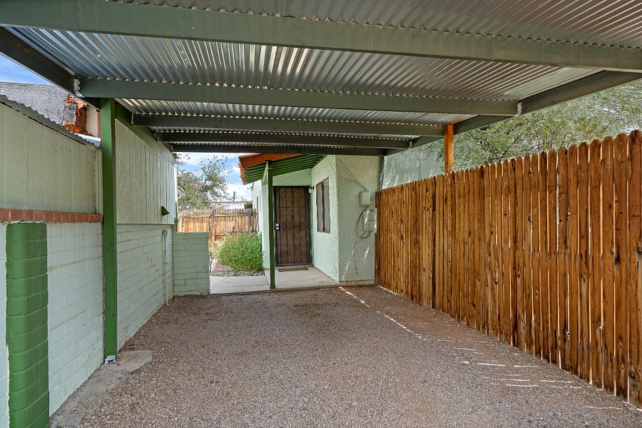 Standing in your carport looking at your front door.